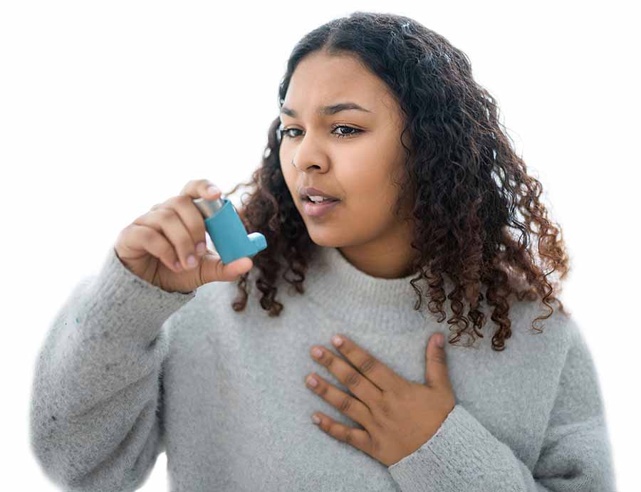 Woman using inhaler