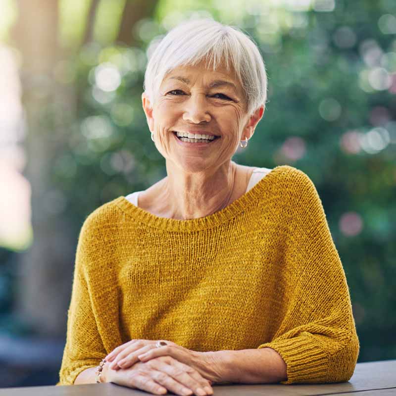 woman wearing yellow jumper